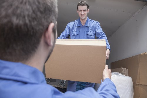 Removal van and moving team handling a London property move