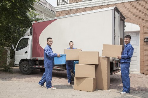 Removal team sorting recyclable items before transport in London