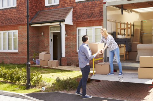 Local moving team unpacking boxes in a London property