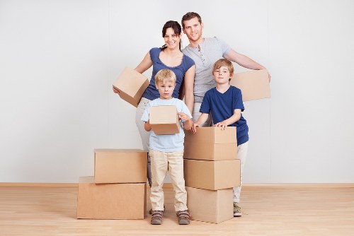 London moving truck loading boxes and furniture for a home move