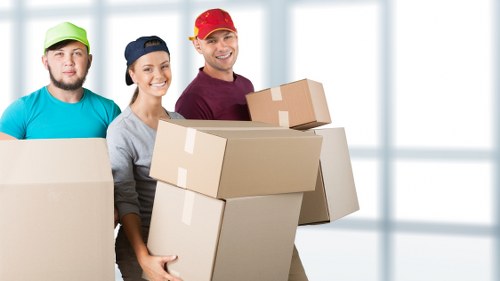 Man with van loading household items for a London move