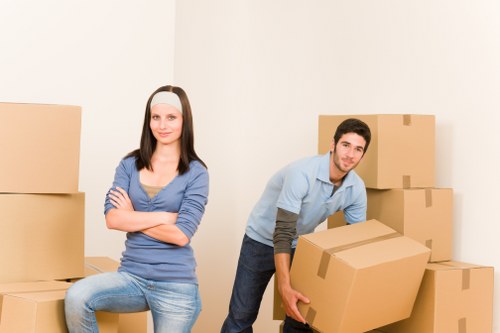 Removal team packing and handling household items for a London move