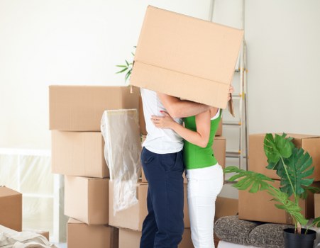 Removal team loading furniture from a London property