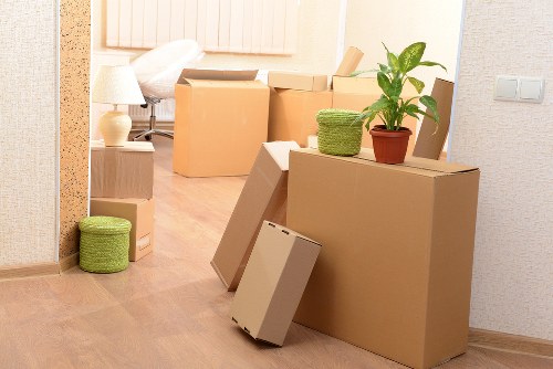 Moving boxes and furniture in a London flat with stair access