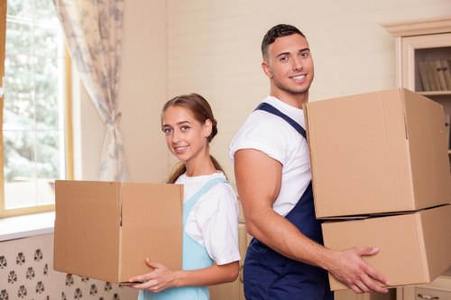 Professional moving team loading boxes and household items