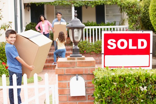 London flat move with removal helpers carrying belongings