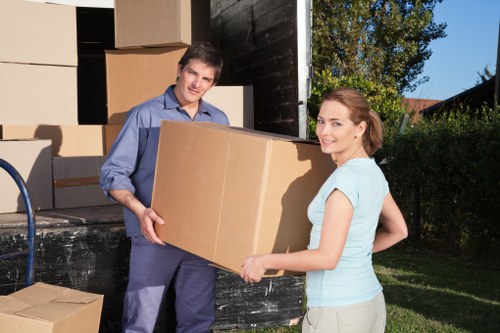Manager reviewing an escalated removals complaint with paperwork